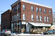 McBride's Pub, 115 Chicago Street. Formally known as Kitty OMalleys. An oasis in the industrial heart of the First Ward. Beautiful planked floors and a full menu of Irish beers. Walk out the front door and look at the waterfronts grain elevator skyline.