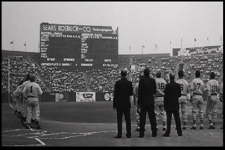 Image from film: News Reel sequence from Knights Field. Buffalo's War Memorial Stadium was fitted with 1930s scoreboard. Note "Rich Products" ad in right field.
