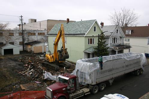 Efforts to preserve the unique urban fabric of Gibson & Lombard Streets, the residential and commercial corridors that boarder the Broadway Public Market in the Historic Polonia District, experienced a major setback. On Wednesday March 29th, fire destroyed a 2 ½ story home at 210 Gibson. Emergency demolition brought the remains of the home down a few days later. The demolition of 210 Gibson follows the removal of 218 Gibson, a former tavern, last May. A neighboring home in deteriorating condition at 214 Gibson most likely will be torn down this spring.