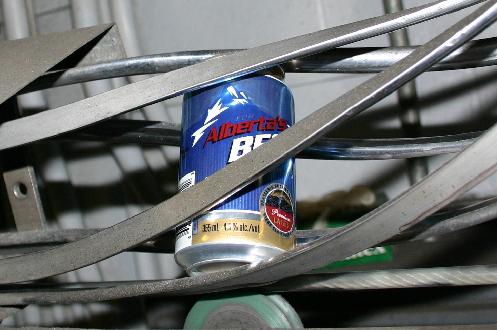 Part of the canning conveyor belt system. Empty cans make their way down the belt to the filling machines
