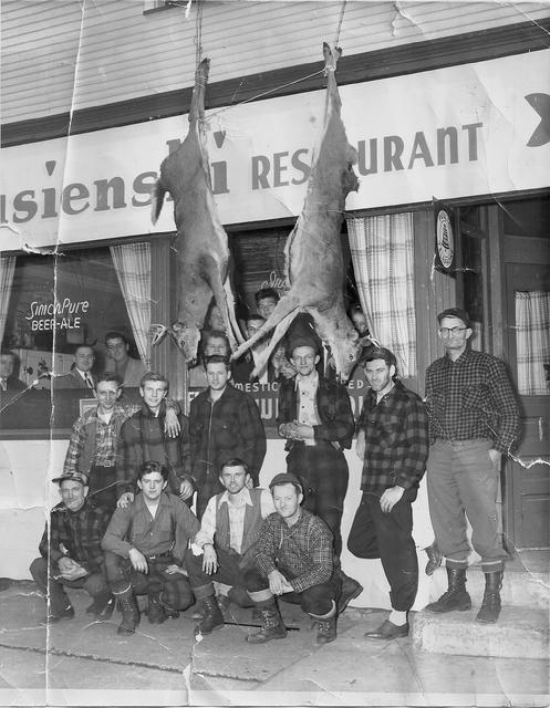 Back at the tavern after deer hunting. Owner John Strusienski (3rd from the left) and above him (in the window) is Julia �Ma� Strusienski.