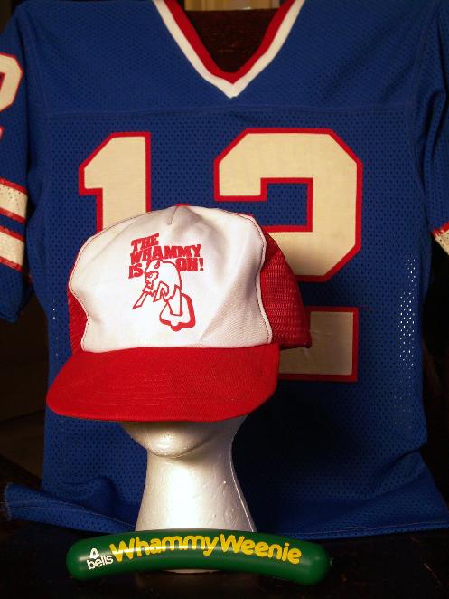 From Steve Cichons StaffAnnouncer.com: A collection of Bells Whammy paraphernalia. A vintage Joe Ferguson jersey is an appropriate backdrop for a 1982 Weenie and a hat promoting the 1983 Talking Proud replacement Whammy. 